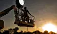film lighting operator on a boom