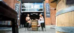 two people enjoying a drink at a micro brewery
