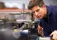 machinist aligns production tools